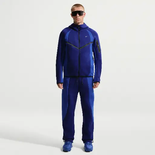 Nike Tech fleecebroek met kleurblokken en open zoom voor heren - Blauw