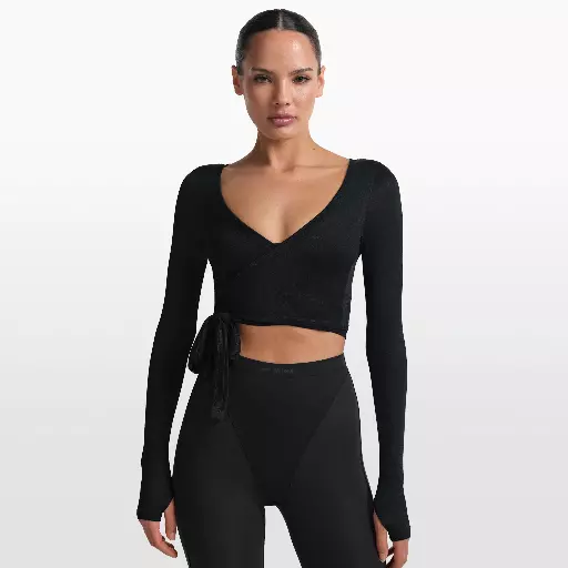 NikeSKIMS Stretch Knit wikkeltop met lange mouwen voor dames - Zwart